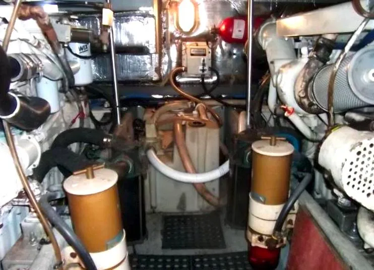 Slide: The Image of Engine room of 2000 Mainship 430 Trawler with visible machinery and components. - 20