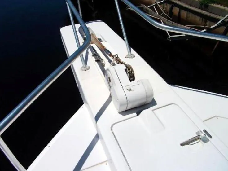 Slide: The Image of Bow of 2000 Mainship 430 Trawler with anchor winch and railings. - 4