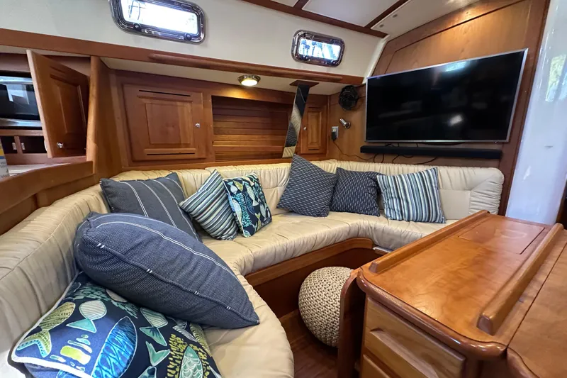 Slide: The Image of Cozy interior of 2017 Tartan 4300 yacht with plush seating and decorative pillows. - 23