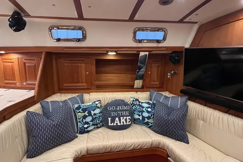 Slide: The Image of Luxurious 2017 Tartan 4300 yacht interior with cozy seating and decorative pillows. - 25