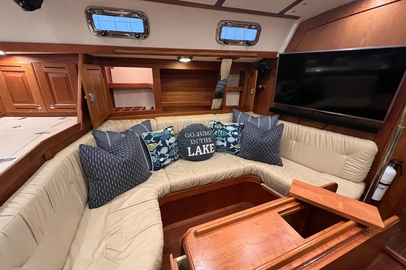 Slide: The Image of Luxurious 2017 Tartan 4300 yacht interior with cozy seating and decorative pillows. - 27