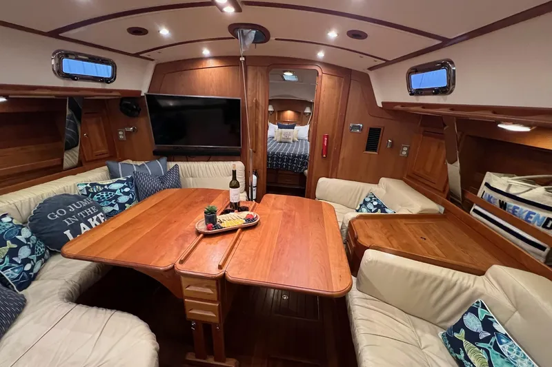 Slide: The Image of Luxurious 2017 Tartan 4300 yacht interior with cozy seating, dining table, and elegant decor. - 29