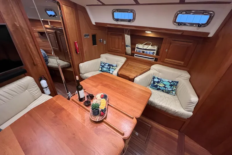 Slide: The Image of Luxurious 2017 Tartan 4300 yacht interior with elegant wood finish and cozy seating area. - 30