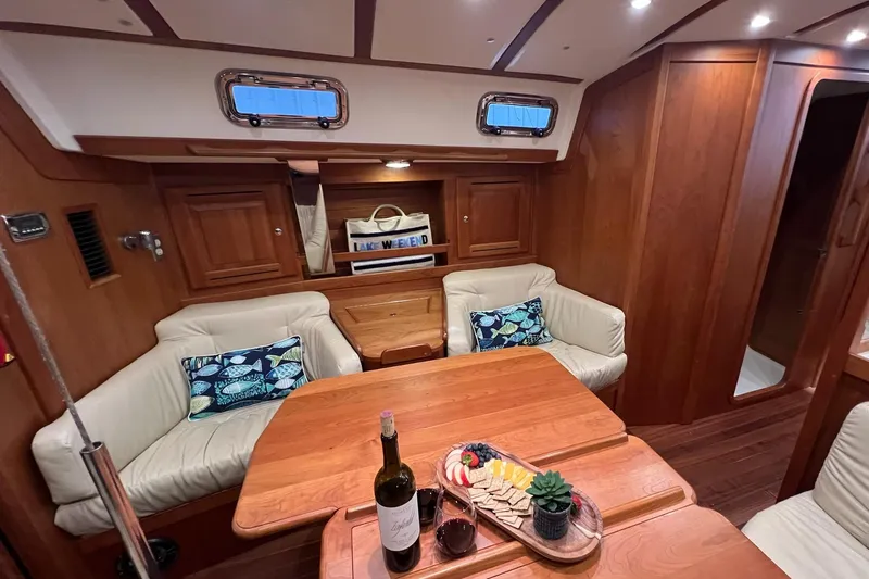 Slide: The Image of Luxurious 2017 Tartan 4300 yacht interior with cozy seating and elegant dining setup. - 31