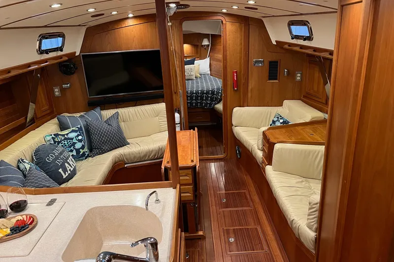 Slide: The Image of Luxurious 2017 Tartan 4300 yacht interior with cozy seating, wood finish, and modern amenities. - 37