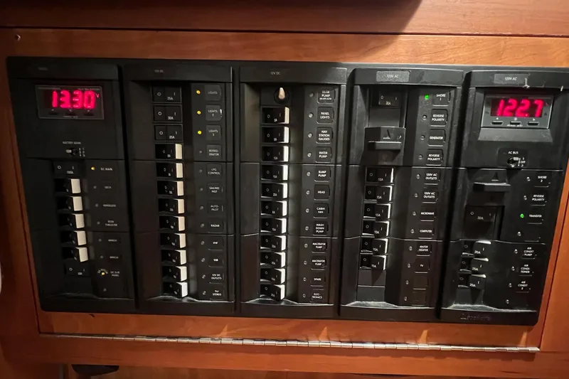 Slide: The Image of Electrical control panel on a 2017 Tartan 4300 yacht, displaying voltage readings. - 45