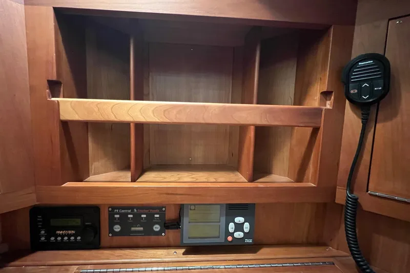 Slide: The Image of Wooden interior of 2017 Tartan 4300 yacht with control panels and radio. - 46