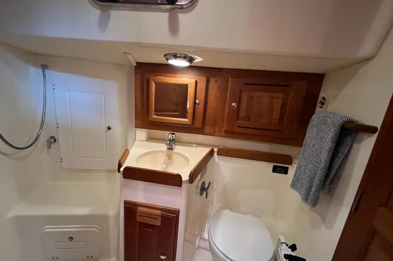 Slide: The Image of Bathroom interior of 2017 Tartan 4300 yacht with wooden cabinets and compact design. - 50