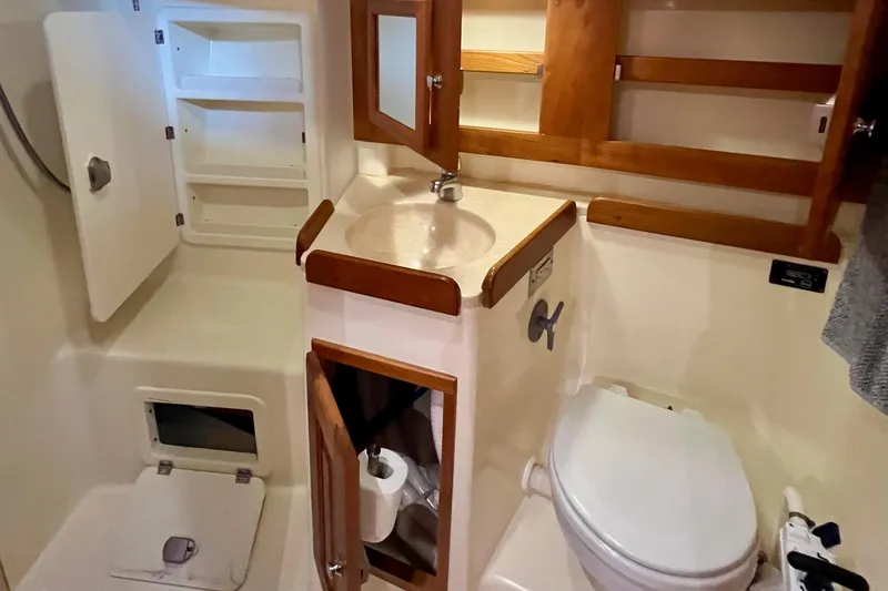 Slide: The Image of Bathroom interior of 2017 Tartan 4300 yacht with wooden cabinetry and compact design. - 51