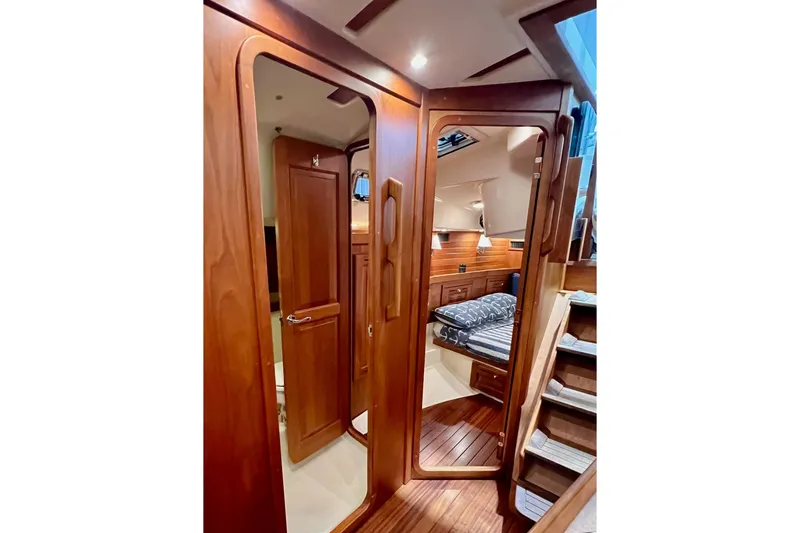 Slide: The Image of Luxurious interior of 2017 Tartan 4300 yacht with wooden finishes and cozy cabin. - 55