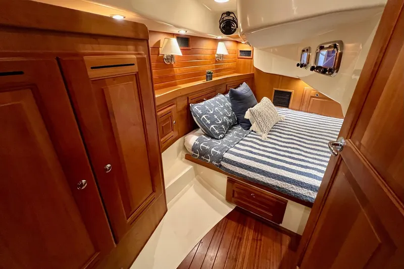 Slide: The Image of Luxurious 2017 Tartan 4300 yacht cabin with cozy bedding and elegant wood finishes. - 56