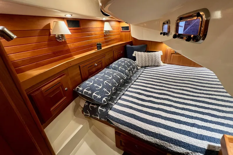 Slide: The Image of Luxurious cabin interior of 2017 Tartan 4300 yacht with nautical-themed bedding. - 58