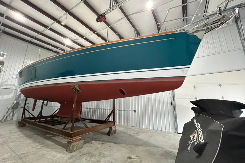 Slide: The Image of 2017 Tartan 4300 sailboat in storage, showcasing sleek design and vibrant colors. - 68