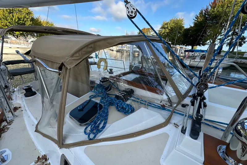 Slide: The Image of Sailboat cockpit of 2017 Tartan 4300 with ropes and canopy in marina setting. - 8