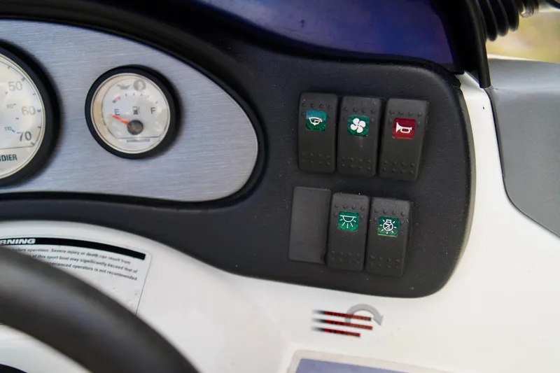 Slide: The Image of Dashboard controls of a 2001 Bombardier 1800 Challenger boat. - 15