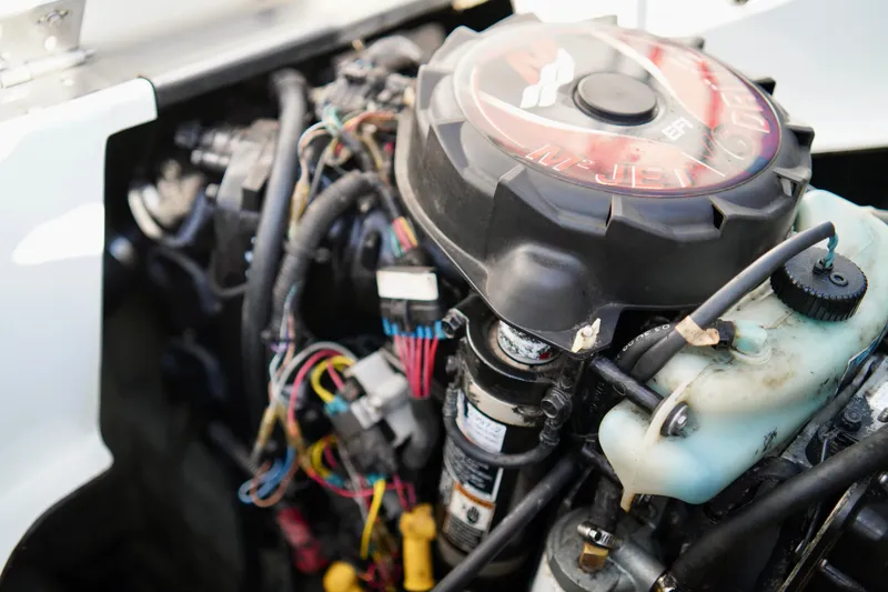 Slide: The Image of Engine of a 2001 Bombardier 1800 Challenger with visible wiring and components. - 24