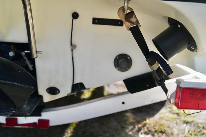 Slide: The Image of Close-up of a 2001 Bombardier 1800 Challenger boat's rear section with trailer attachment. - 29