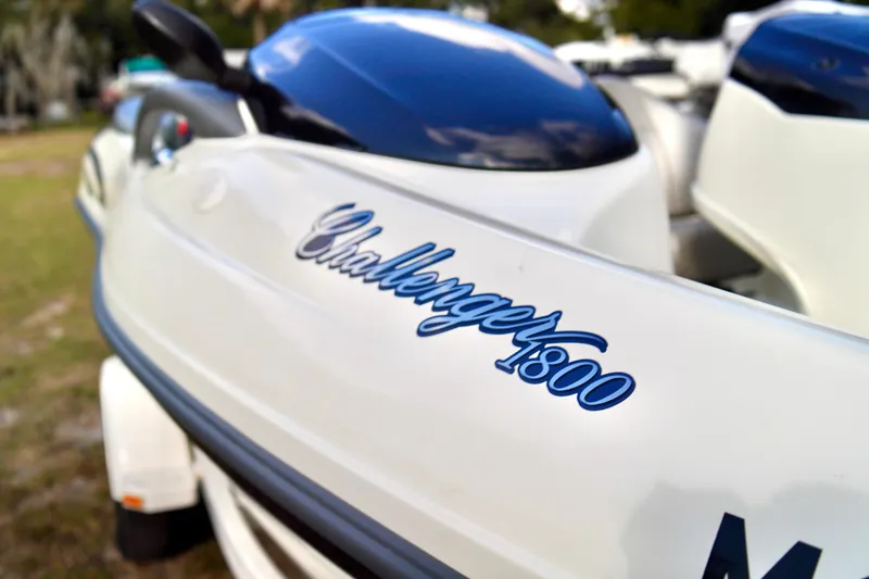 Slide: The Image of 2001 Bombardier 1800 Challenger boat with sleek design and logo detail. - 9