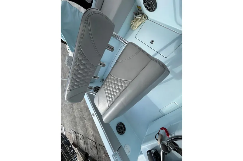 Slide: The Image of 2024 Contender 24 Sport boat interior with stylish gray seating and modern design. - 15
