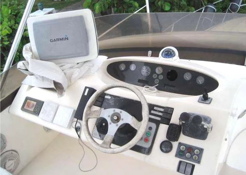 Slide: The Image of Control panel of a 1998 Viking Sports Cruiser with Garmin navigation system. - 24