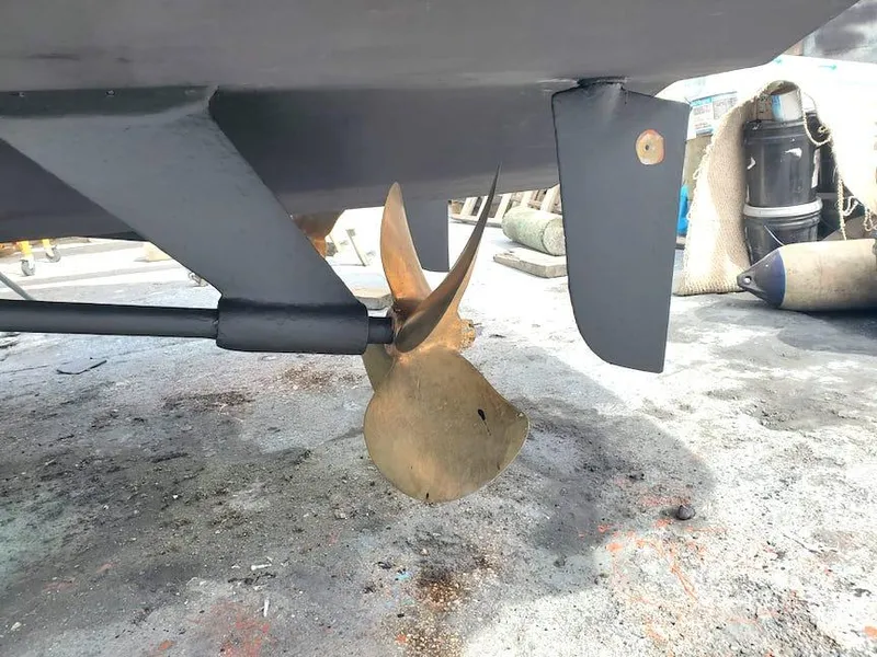 Slide: The Image of Propeller and rudder of a 1998 Viking Sports Cruiser on dry dock. - 39