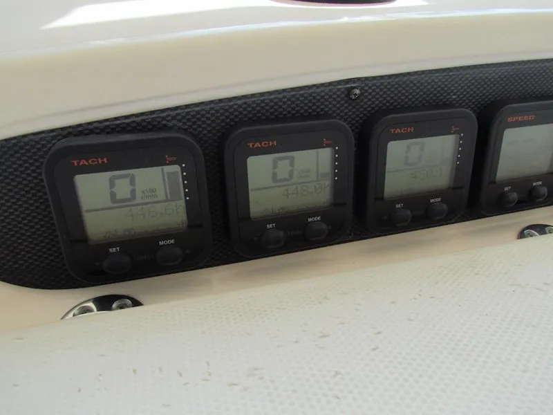 Slide: The Image of Dashboard of a 2008 Grady-White Express 360 boat with digital tachometers. - 10