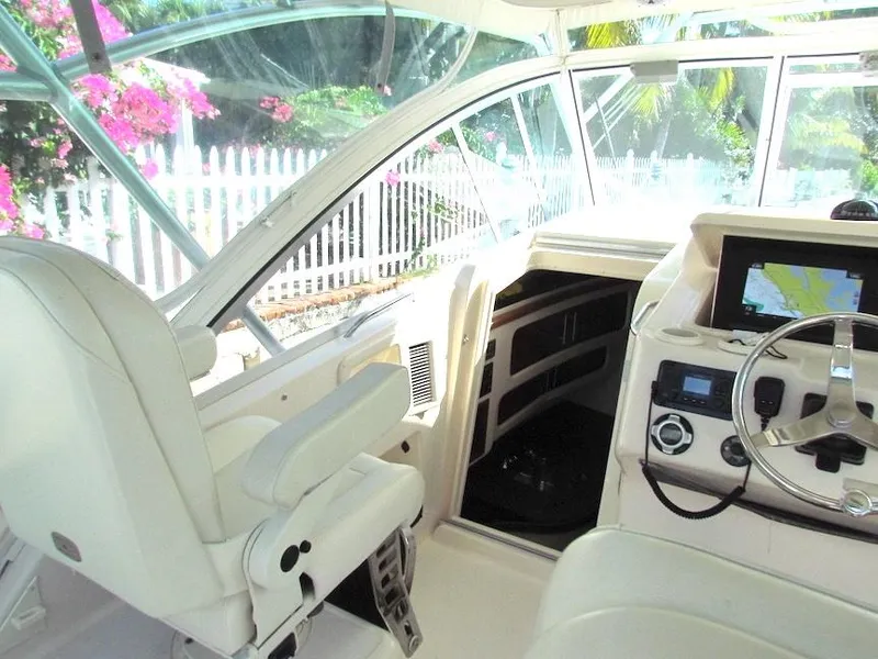Slide: The Image of 2008 Grady-White Express 360 helm with steering wheel and navigation system. - 11