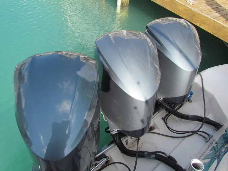 Slide: The Image of Three outboard motors on a 2008 Grady-White Express 360 boat. - 13