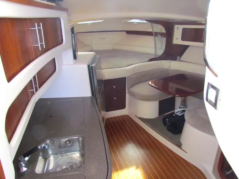 Slide: The Image of Interior of 2008 Grady-White Express 360 boat with kitchen and seating area. - 14