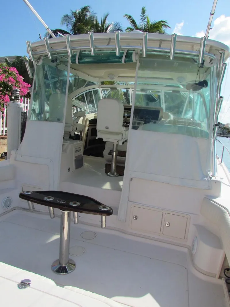 Slide: The Image of 2008 Grady-White Express 360 boat with cockpit view, featuring seating and rod holders. - 29