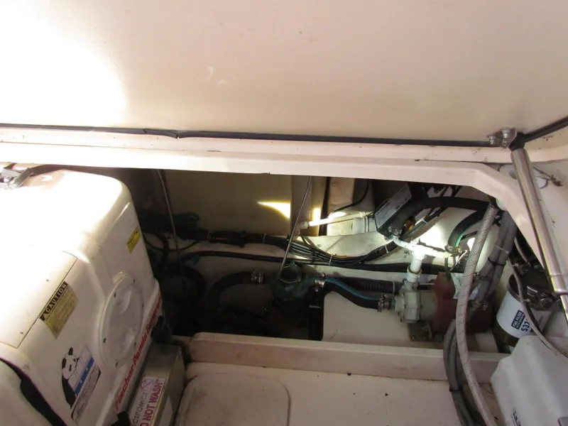 Slide: The Image of Engine compartment of 2008 Grady-White Express 360 boat, showing mechanical components and wiring. - 34