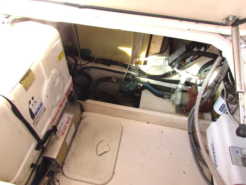 Slide: The Image of Engine compartment of 2008 Grady-White Express 360 boat, showing mechanical components and wiring. - 35