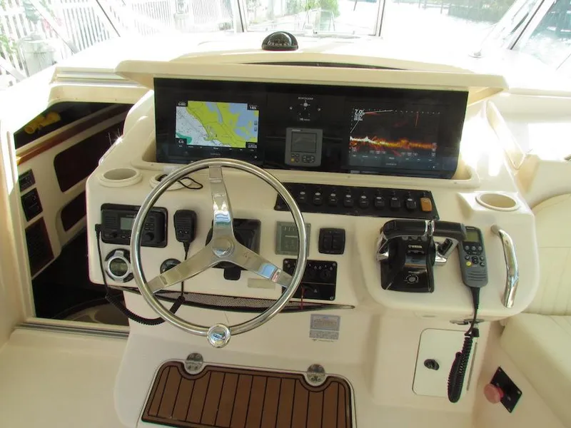 Slide: The Image of 2008 Grady-White Express 360 helm with navigation screens and controls. - 7