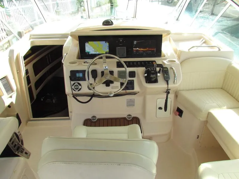 Slide: The Image of 2008 Grady-White Express 360 helm with navigation equipment and plush seating. - 8