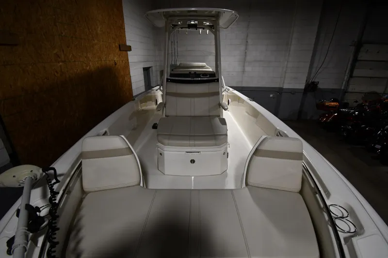 Slide: The Image of 2022 Boston Whaler 250 Dauntless boat interior with seating and console. - 12