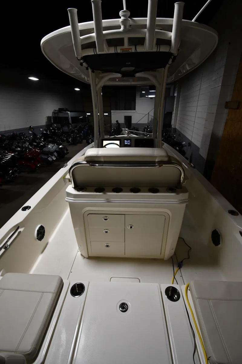 Slide: The Image of 2022 Boston Whaler 250 Dauntless boat interior with seating and storage compartments. - 16