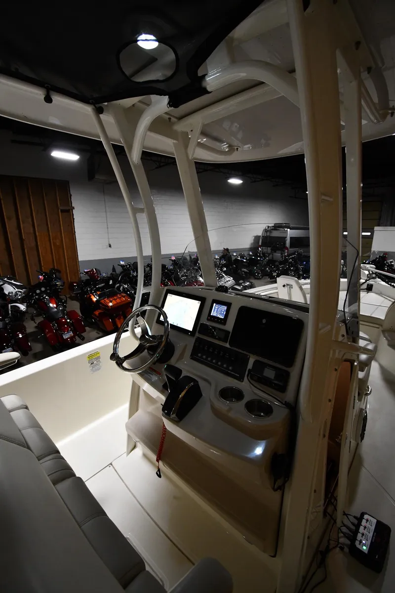 Slide: The Image of 2022 Boston Whaler 250 Dauntless boat interior with modern helm and controls. - 18