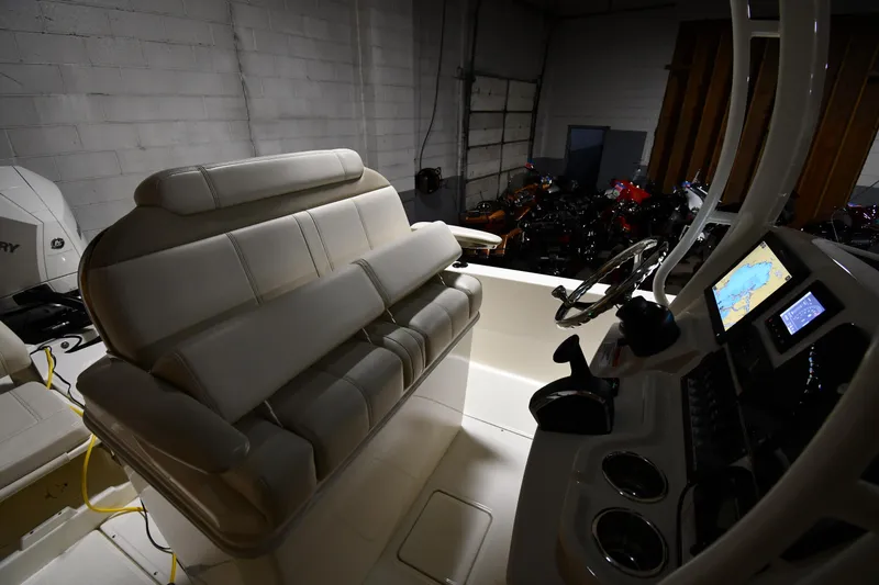 Slide: The Image of 2022 Boston Whaler 250 Dauntless boat interior with seating and control panel. - 20