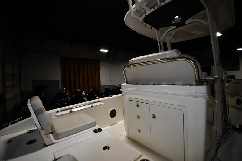 Slide: The Image of 2022 Boston Whaler 250 Dauntless boat interior with seating and storage compartments. - 24