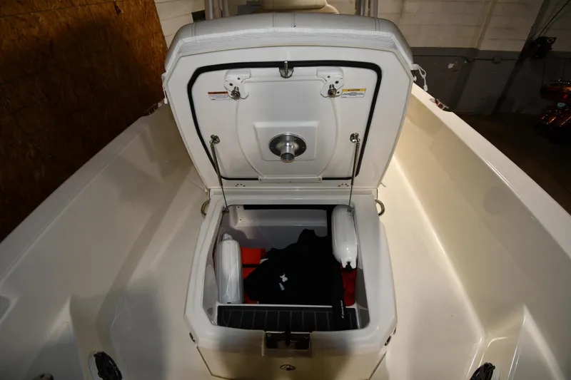 Slide: The Image of 2022 Boston Whaler 250 Dauntless storage compartment with open lid, showcasing interior space. - 40