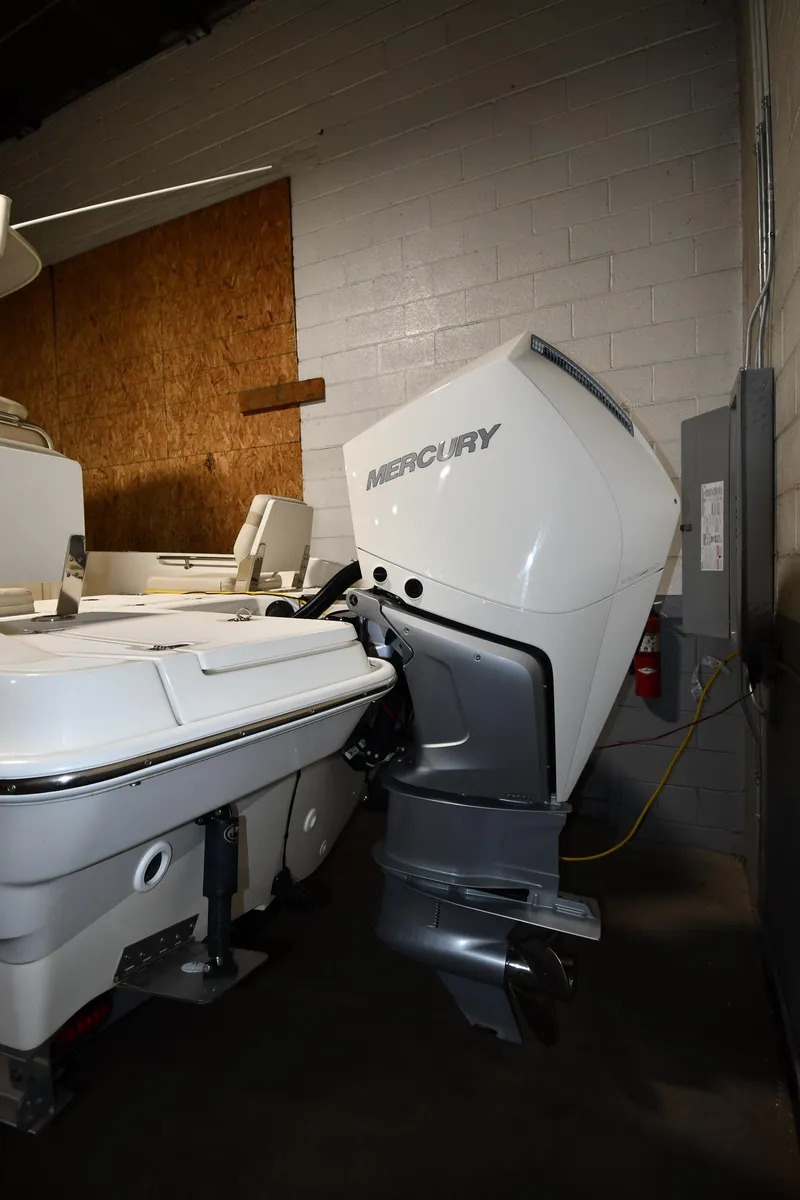 Slide: The Image of 2022 Boston Whaler 250 Dauntless boat with Mercury outboard motor in storage. - 5
