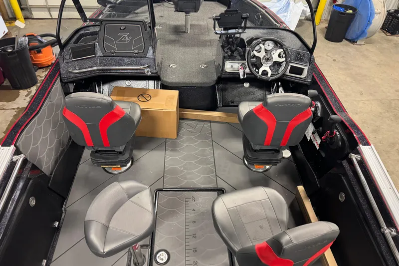 Slide: The Image of Interior of 2026 Nitro ZV20 Sport Pro boat with modern seating and dashboard. - 13