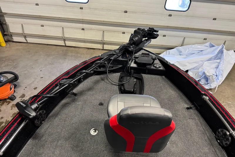 Slide: The Image of 2026 Nitro ZV20 Sport Pro boat interior with Garmin equipment in a garage setting. - 15