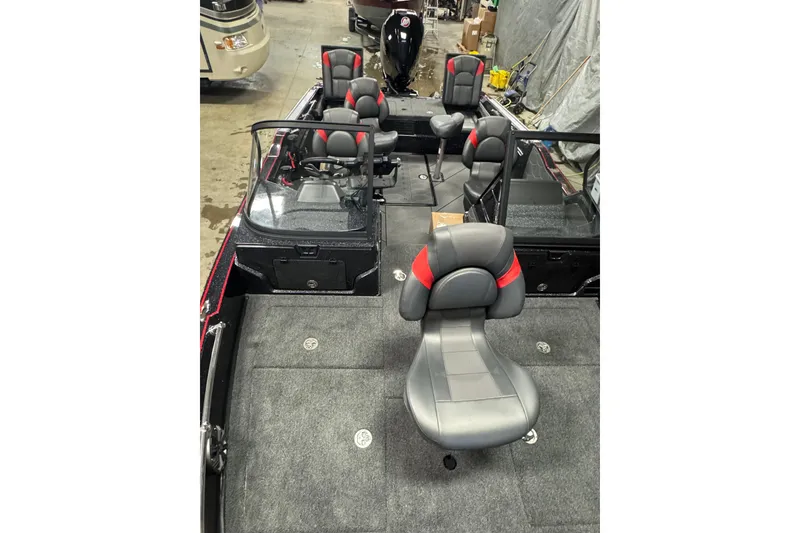 Slide: The Image of 2026 Nitro ZV20 Sport Pro boat interior with multiple seats in a garage setting. - 16