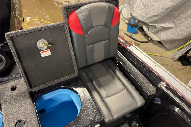 Slide: The Image of 2026 Nitro ZV20 Sport Pro boat seat with storage compartment and blue interior. - 23