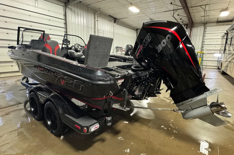 Slide: The Image of 2026 Nitro ZV20 Sport Pro boat with powerful engine in indoor storage. - 4