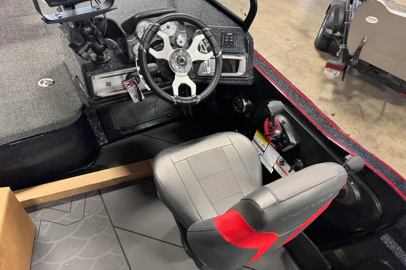 Slide: The Image of Interior of 2026 Nitro ZV20 Sport Pro boat with steering wheel and seat. - 7