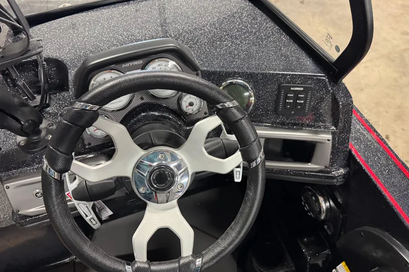 Slide: The Image of 2026 Nitro ZV20 Sport Pro boat dashboard with steering wheel and control panel. - 9