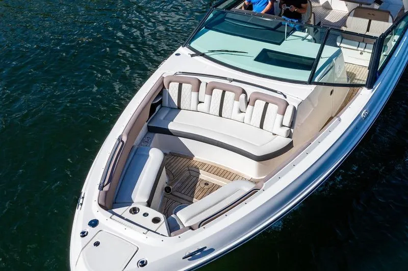 Slide: The Image of 2019 Sea Ray SLX 400 Outboard boat with spacious seating on calm water. - 19