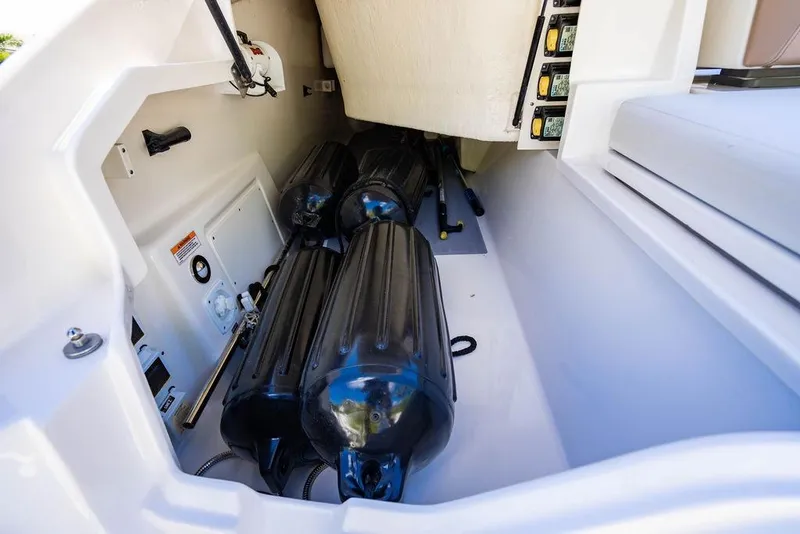 Slide: The Image of Storage compartment of 2019 Sea Ray SLX 400 Outboard with fenders and equipment. - 22